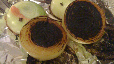 Result or onions burned in a frying pan protected by aluminium foil to cook a Pot-au-feu